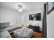 Comfortable living room with hardwood floors, and a mounted television at 3464 Navaho Se Trl, Smyrna, GA 30080