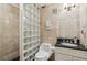 Well-lit bathroom with a glass block shower, classic tiles, and a sleek vanity, offering a blend of style and functionality at 685 Argonne Ne Ave # 15, Atlanta, GA 30308