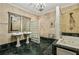 This bathroom features duel sinks, marble tile, and a walk-in shower and jetted tub at 685 Argonne Ne Ave # 15, Atlanta, GA 30308
