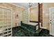 This bathroom features marble tile, a chandelier, and a walk-in shower with glass-block window at 685 Argonne Ne Ave # 15, Atlanta, GA 30308