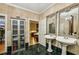 Bathroom with duel sinks, marble tile, walk-in closet, and bedroom view at 685 Argonne Ne Ave # 15, Atlanta, GA 30308