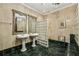 This bathroom features duel sinks, marble tile, and a walk-in shower with glass-block window at 685 Argonne Ne Ave # 15, Atlanta, GA 30308