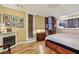This bedroom features hardwood floors, a decorative ceiling, fireplace, and track lighting at 685 Argonne Ne Ave # 15, Atlanta, GA 30308