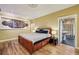 This bedroom features hardwood floors, a decorative ceiling, and a view into the bathroom at 685 Argonne Ne Ave # 15, Atlanta, GA 30308