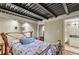 Charming bedroom features a unique wood bedframe and exposed ceiling, creating a rustic yet modern ambiance at 685 Argonne Ne Ave # 15, Atlanta, GA 30308