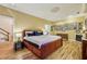 This bedroom features hardwood floors, a king-size bed, decorative ceiling, and many Gathering pictures on the wall at 685 Argonne Ne Ave # 15, Atlanta, GA 30308