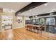 Spacious dining room with hardwood floors, access to a kitchen, and a view of exposed brick at 685 Argonne Ne Ave # 15, Atlanta, GA 30308
