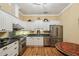 Contemporary kitchen featuring stainless steel appliances, granite countertops, and elegant white cabinetry at 685 Argonne Ne Ave # 15, Atlanta, GA 30308