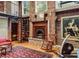 Living room with a spiral staircase, exposed brick, and a charming stone fireplace at 685 Argonne Ne Ave # 15, Atlanta, GA 30308