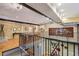 Mezzanine with iron railings overlooking the living room with artistic wall decor at 685 Argonne Ne Ave # 15, Atlanta, GA 30308