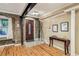 Inviting living room featuring a brick accent wall, hardwood floors, and ample natural light, perfect for relaxation and entertaining at 685 Argonne Ne Ave # 15, Atlanta, GA 30308
