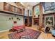 Living room showcasing exposed brick walls, mezzanine, and cozy seating area with hardwood floors at 685 Argonne Ne Ave # 15, Atlanta, GA 30308