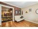 Inviting sitting area with exposed brick, hardwood floors, and a view of the metal railing at 685 Argonne Ne Ave # 15, Atlanta, GA 30308