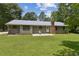 View of the home's back exterior showing the large yard and patio space at 146 Pine St, Covington, GA 30014