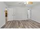 Bright bedroom features neutral colors, vinyl flooring and access to other rooms at 146 Pine St, Covington, GA 30014