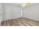 This bedroom features neutral colors, vinyl flooring and a ceiling fan at 146 Pine St, Covington, GA 30014