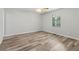 This bedroom features modern vinyl plank flooring, light gray walls, and a ceiling fan at 146 Pine St, Covington, GA 30014