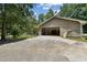 Spacious garage with an open door and concrete driveway for easy parking at 146 Pine St, Covington, GA 30014