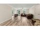 Spacious living room featuring hardwood style floors and a door leading to the backyard at 146 Pine St, Covington, GA 30014