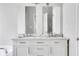 Bright bathroom vanity featuring double sinks and a white marble countertop at 2005 Chicago Nw Ave, Atlanta, GA 30314