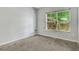 A bedroom featuring a window with natural light and neutral tones at 2005 Chicago Nw Ave, Atlanta, GA 30314