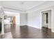 Bright living room featuring hardwood floors, crown molding and access to the Kitchen and Bathroom at 2005 Chicago Nw Ave, Atlanta, GA 30314