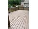 Backyard showing the deck of the house with brown railings and an expansive backyard at 1833 Phillips Ave, East Point, GA 30344