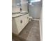 Bathroom features a modern vessel sink, granite countertop, and a glass-enclosed shower at 1833 Phillips Ave, East Point, GA 30344