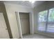 Bedroom features a standard closet and a sunlit window at 1833 Phillips Ave, East Point, GA 30344