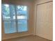 Bedroom with natural light from a window and a double door closet at 1833 Phillips Ave, East Point, GA 30344