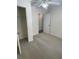 Bedroom featuring carpet, a ceiling fan, and a view of the closet and doorway to the hallway at 1833 Phillips Ave, East Point, GA 30344