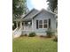 Charming blue house with a well-manicured lawn and a welcoming front porch at 1833 Phillips Ave, East Point, GA 30344
