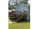 Exterior of house with light-blue siding, a rear wood deck, and lush green lawn at 1833 Phillips Ave, East Point, GA 30344