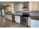 Updated kitchen showcasing granite countertops, stainless steel appliances, and ample cabinet space at 1833 Phillips Ave, East Point, GA 30344