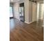 Living room features wood-look floors and an entrance to an additional space at 1833 Phillips Ave, East Point, GA 30344