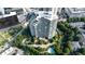 Aerial view of the building, showcasing its unique architecture, landscaping, and pool at 700 Park Regency Ne Pl # 1605, Atlanta, GA 30326