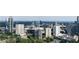 Sweeping aerial view of a city skyline with lush greenery and modern high-rise buildings at 700 Park Regency Ne Pl # 1605, Atlanta, GA 30326