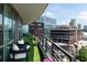 Spacious balcony overlooking the city, with turf flooring and comfortable seating at 700 Park Regency Ne Pl # 1605, Atlanta, GA 30326