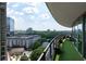 A luxurious balcony with artificial grass and cityscape views, perfect for outdoor relaxation at 700 Park Regency Ne Pl # 1605, Atlanta, GA 30326