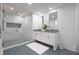Bathroom with double vanity, ample lighting, and a tiled walk-in shower at 700 Park Regency Ne Pl # 1605, Atlanta, GA 30326
