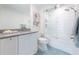 Contemporary bathroom featuring sleek vanity, updated shower-over-tub with tile surround, and blue tile flooring at 700 Park Regency Ne Pl # 1605, Atlanta, GA 30326