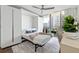 Comfortable bedroom with a murphy bed, desk area, and views to the balcony at 700 Park Regency Ne Pl # 1605, Atlanta, GA 30326