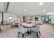 Bright common room with comfortable chairs, tables, and fireplace, perfect for gathering and relaxation at 700 Park Regency Ne Pl # 1605, Atlanta, GA 30326