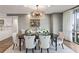 Elegant dining room with chandelier and window view of the city at 700 Park Regency Ne Pl # 1605, Atlanta, GA 30326
