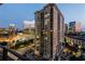 Luxury high-rise building with private balconies and city views at dusk at 700 Park Regency Ne Pl # 1605, Atlanta, GA 30326