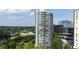 Modern high-rise building with sleek design and glass balconies offering city views at 700 Park Regency Ne Pl # 1605, Atlanta, GA 30326