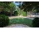 Well-maintained courtyard with manicured lawns, trimmed shrubbery, and seating, creating a peaceful retreat at 700 Park Regency Ne Pl # 1605, Atlanta, GA 30326