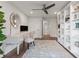 Bright office featuring built-in shelves, modern decor, desk, and view of ensuite bathroom at 700 Park Regency Ne Pl # 1605, Atlanta, GA 30326
