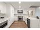Modern kitchen with stainless steel appliances and quartz countertop at 700 Park Regency Ne Pl # 1605, Atlanta, GA 30326