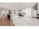 Spacious white kitchen with a large island, stainless steel appliances, and an open floor plan at 700 Park Regency Ne Pl # 1605, Atlanta, GA 30326